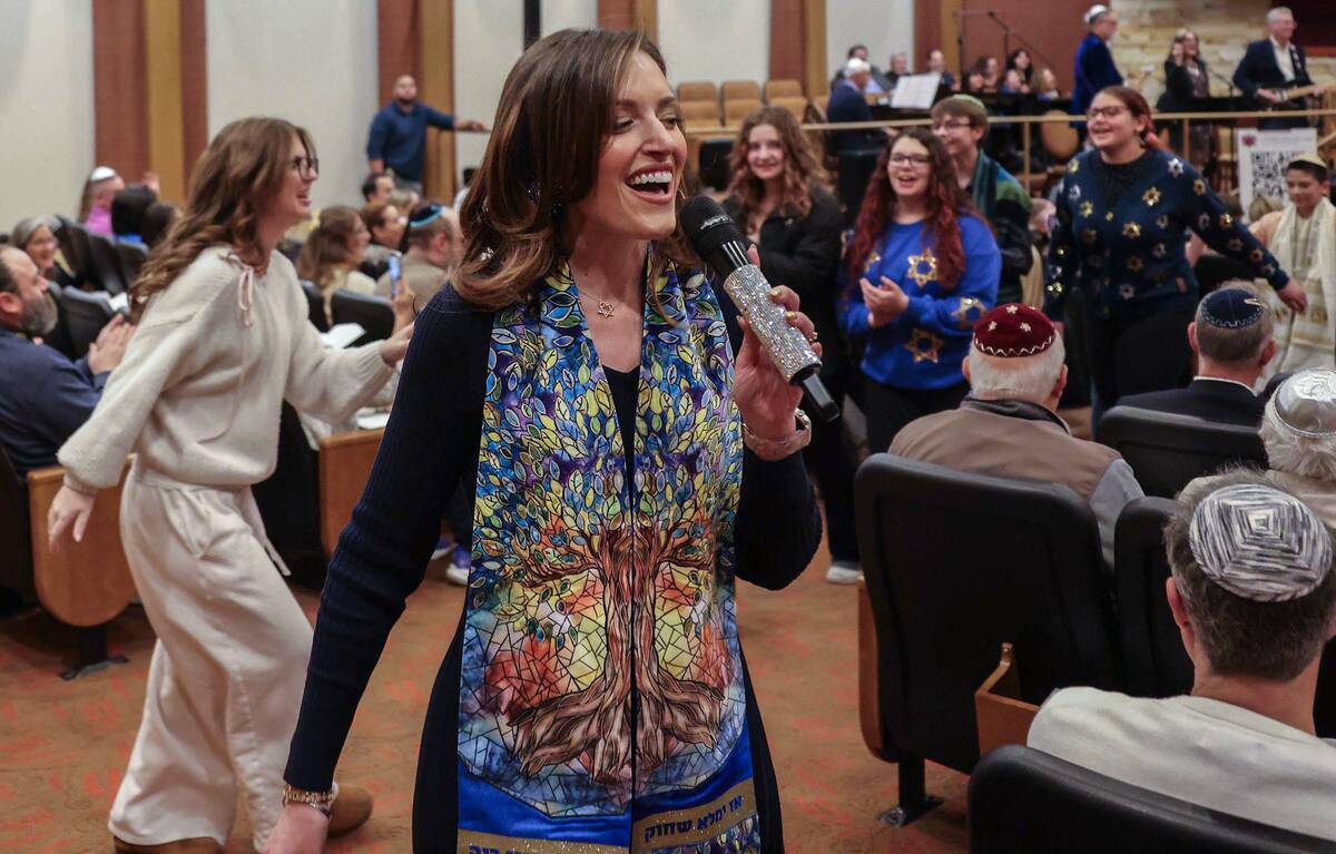 Rabbi-Cantor Jessica Hutchings sings with religious students during a ceremony to formally inst ...