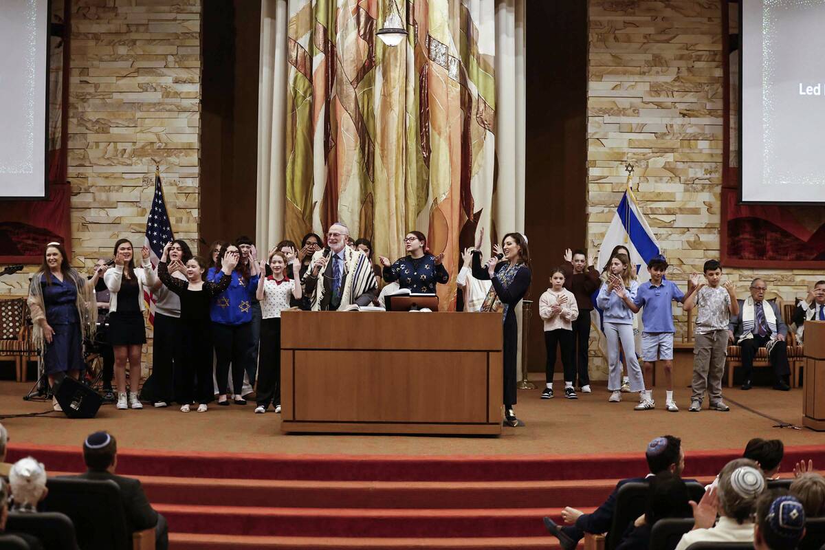 Rabbi-Cantor Jessica Hutchings, top/right, sings with CNT religious students during a ceremony ...