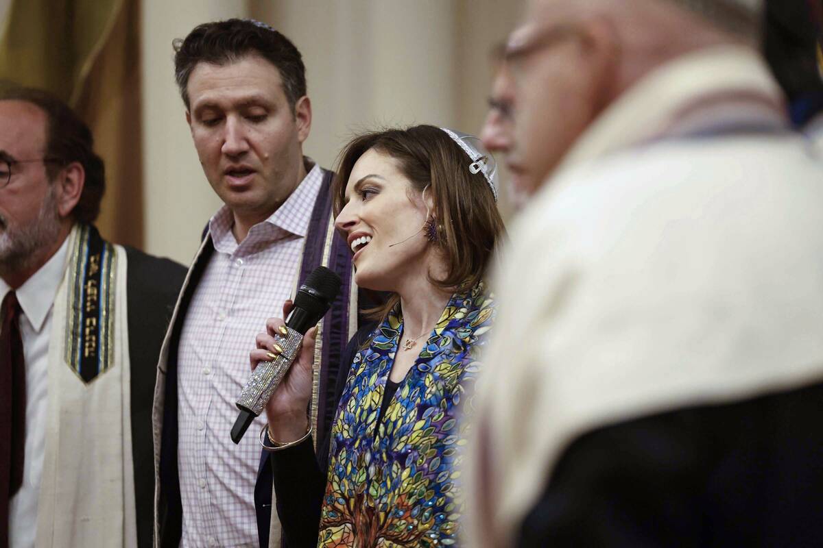 Rabbi-Cantor Jessica Hutchings, middle, sings with fellow religious leaders during a ceremony t ...
