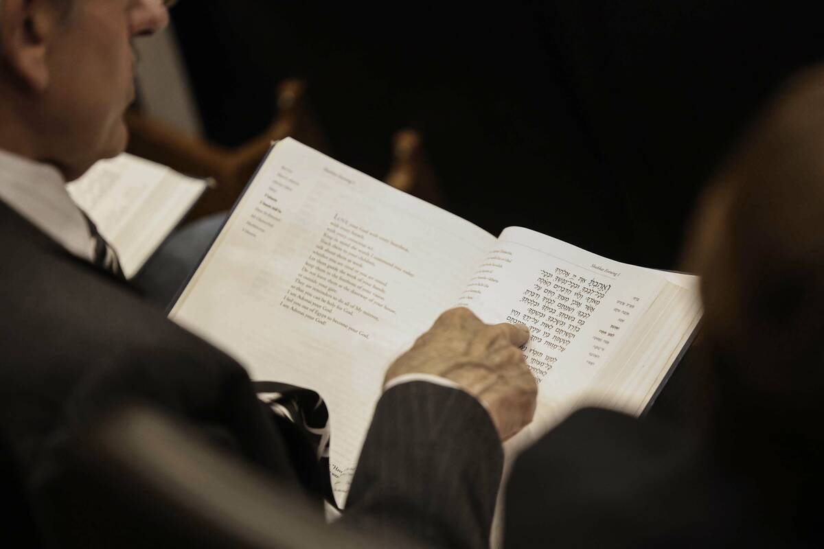 Congregants read scripture during the installation ceremony of Rabbi-Cantor Jessica Hutchings a ...