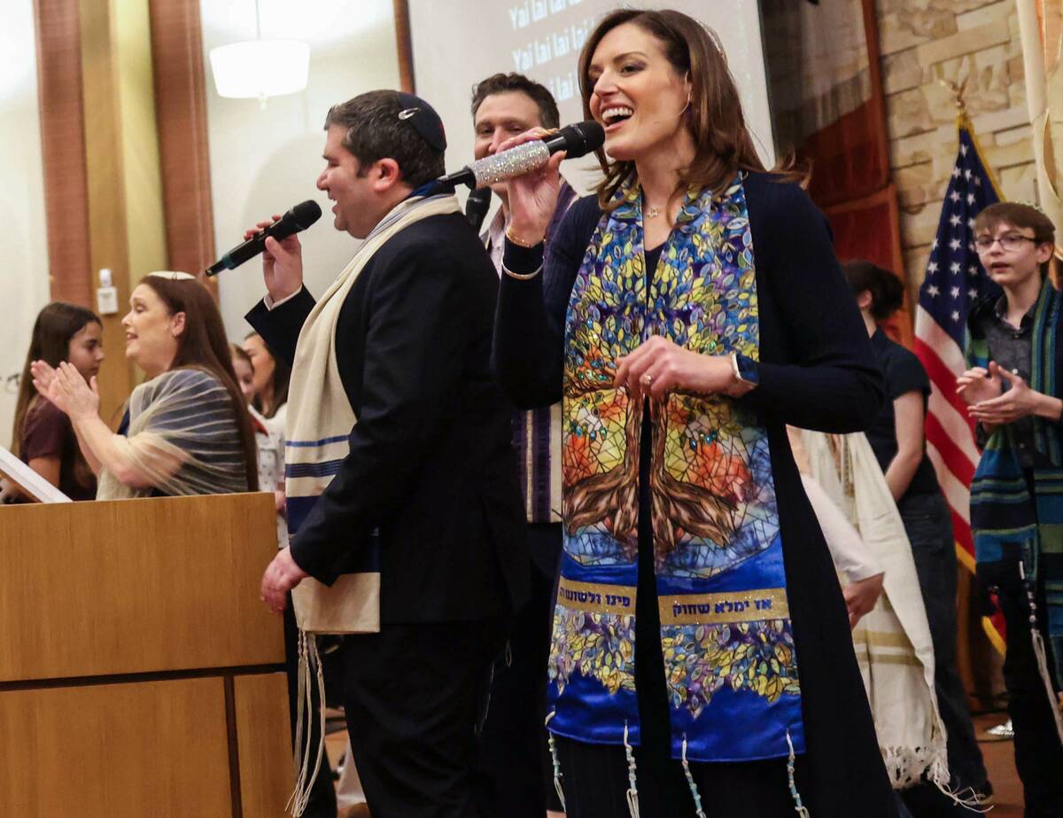 Rabbi-Cantor Jessica Hutchings, right, sings during a ceremony to formally install her as Congr ...