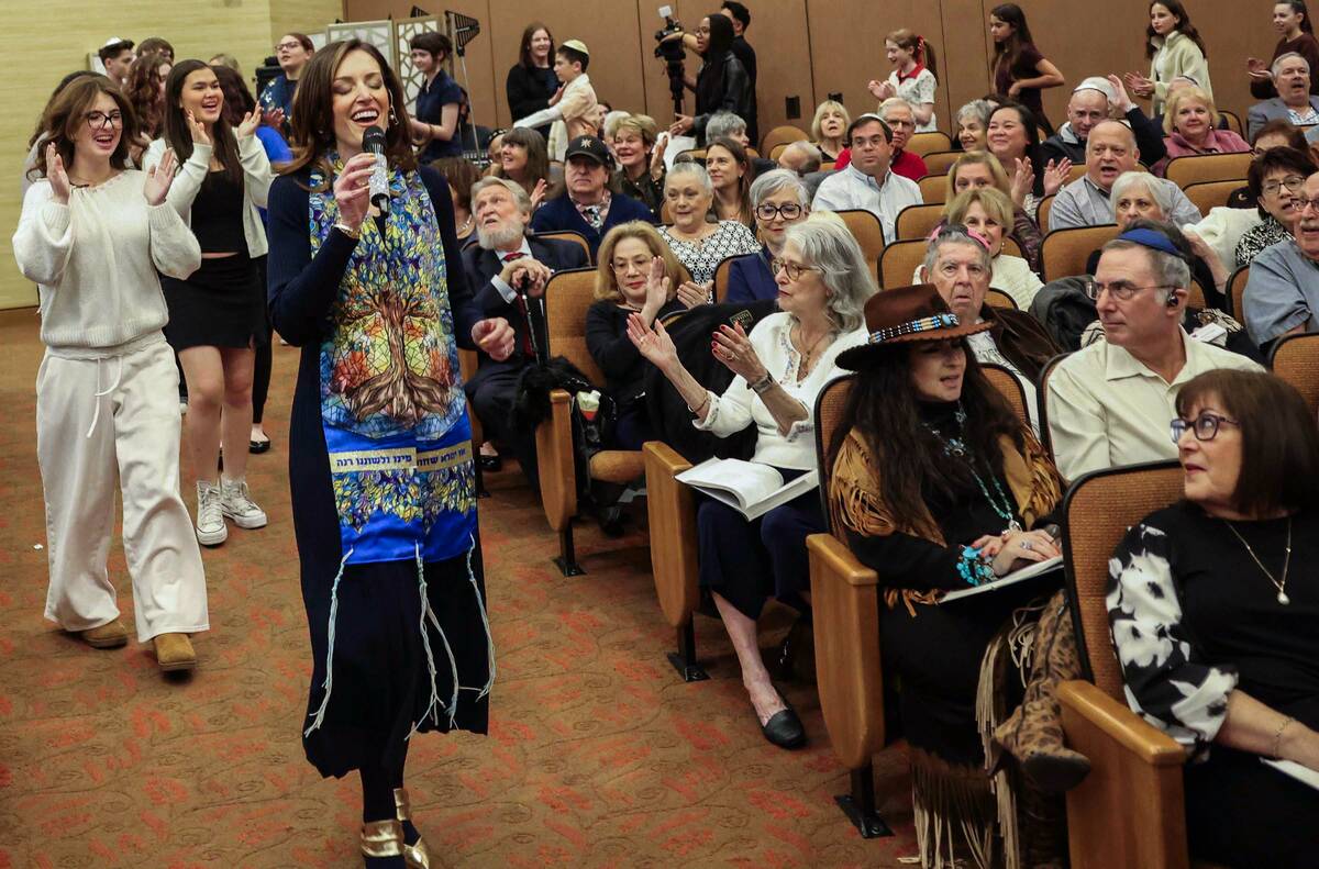 Rabbi-Cantor Jessica Hutchings sings with religious students during a ceremony to formally inst ...