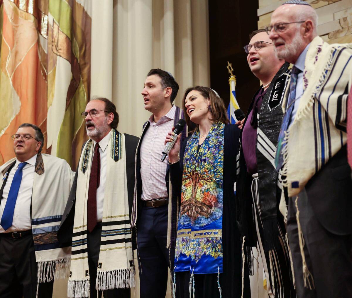 Rabbi-Cantor Jessica Hutchings, third from right, sings with fellow religious leaders during a ...