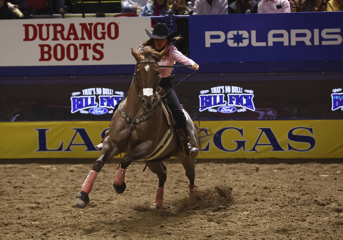 Andrea Busby competes in barrel racing during the fifth go-round of the National Finals Rodeo a ...