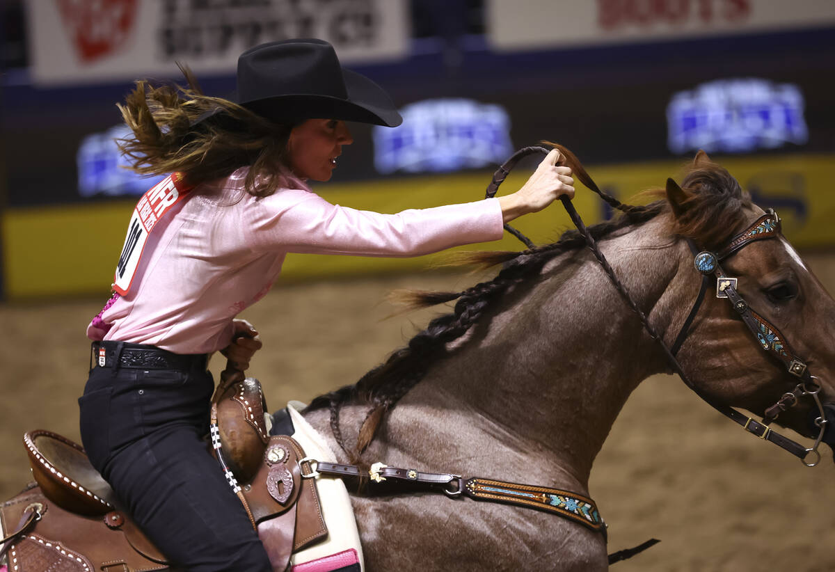 Andrea Busby competes in barrel racing during the fifth go-round of the National Finals Rodeo a ...