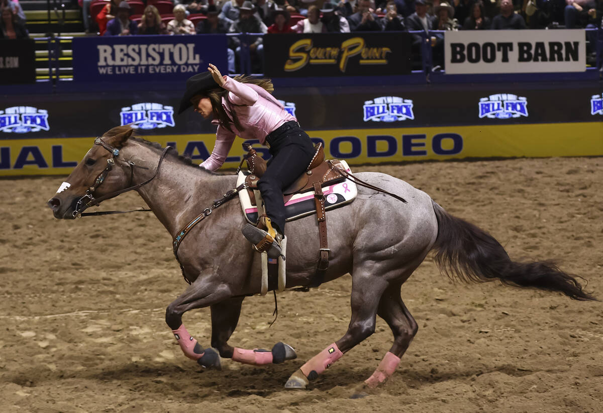 Andrea Busby competes in barrel racing during the fifth go-round of the National Finals Rodeo a ...