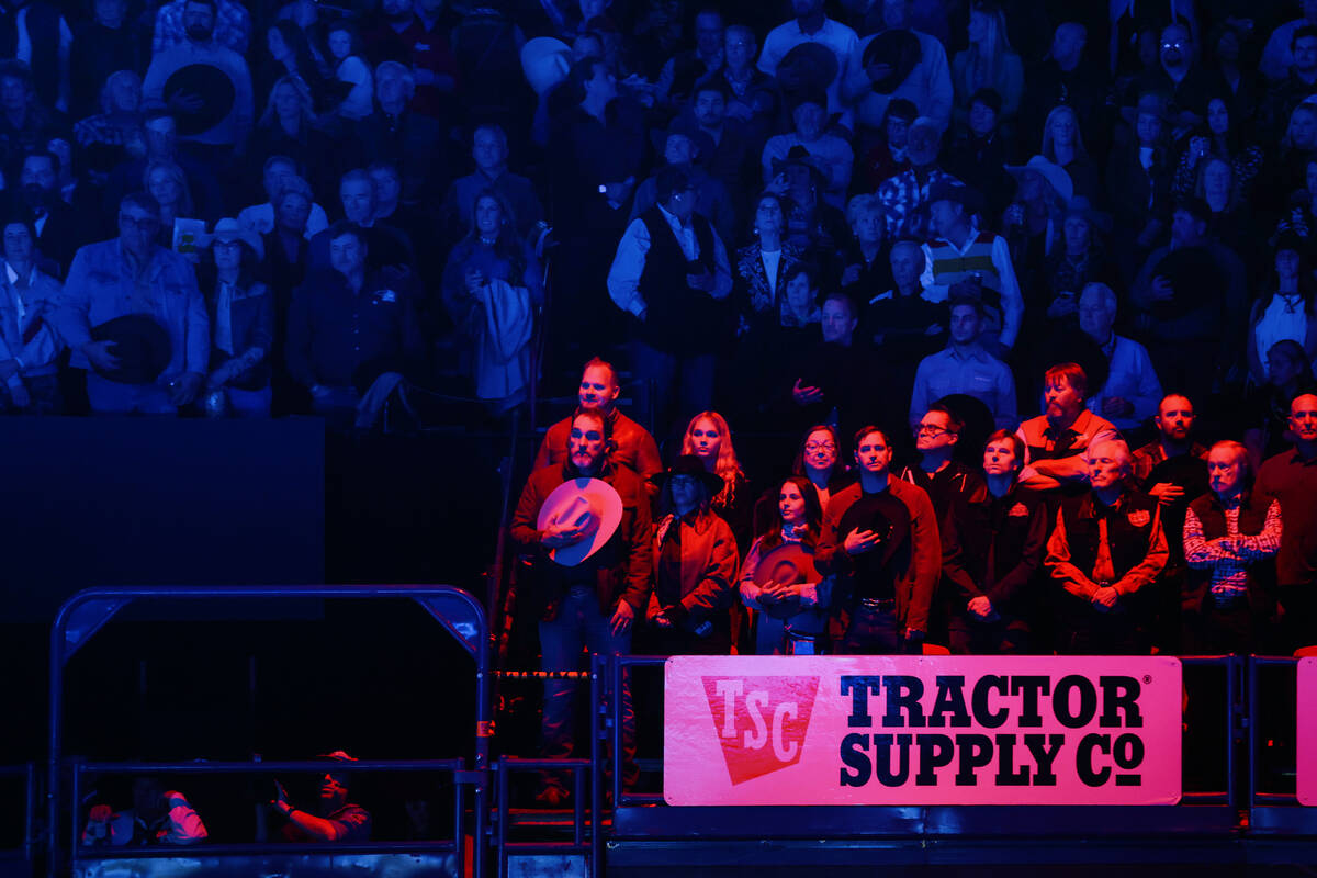 Fans stand for the playing of the national anthem during the seventh go-round of the National F ...