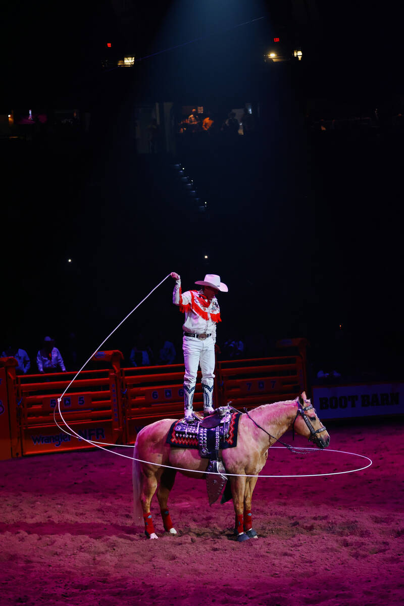 Rider Kiesner performs between events during the seventh go-round of the National Finals Rodeo ...