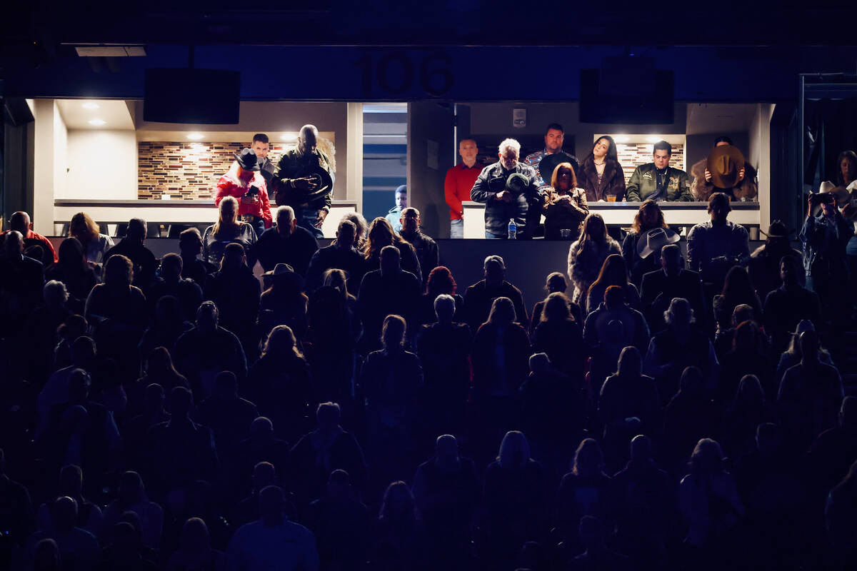 The crowd bows their heads in prayer during the opening ceremony for the seventh go-round of th ...