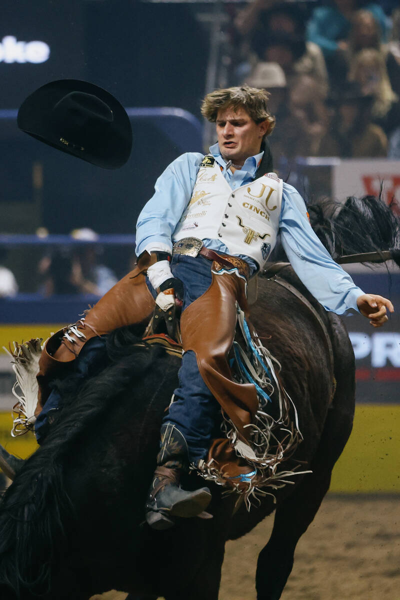 Cooper Cooke rides Hangover Face in the bareback riding event during the seventh go-round of th ...
