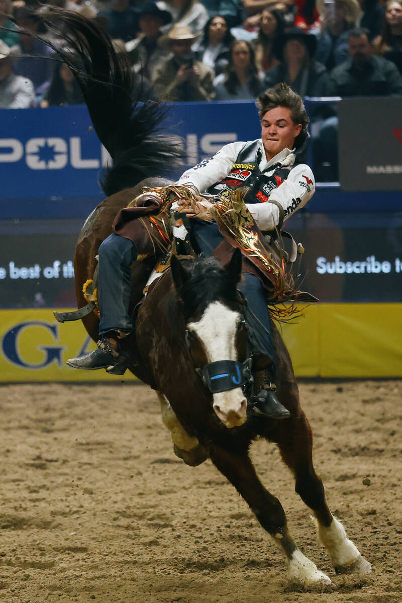Wacey Schalla rides All Pink in the bareback riding event during the seventh go-round of the Na ...