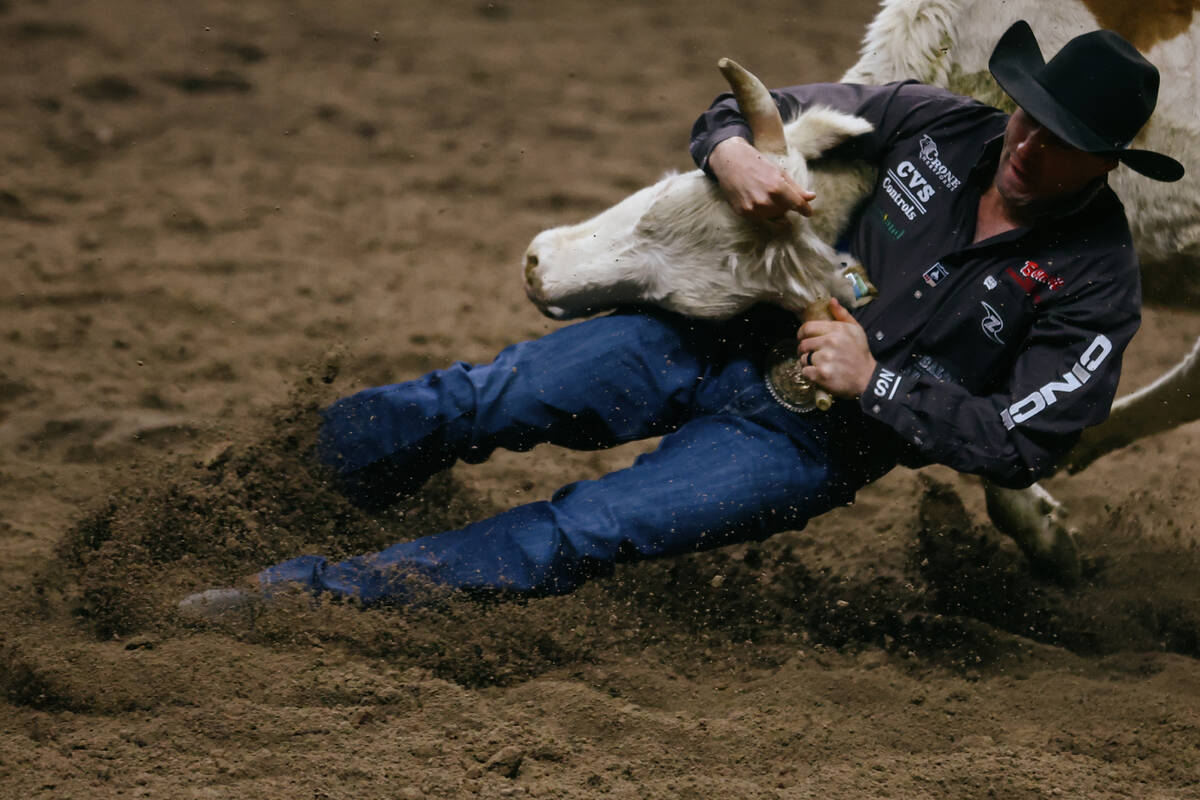 Scott Guenthner competes in the steer wrestling event during the seventh go-round of the Nation ...