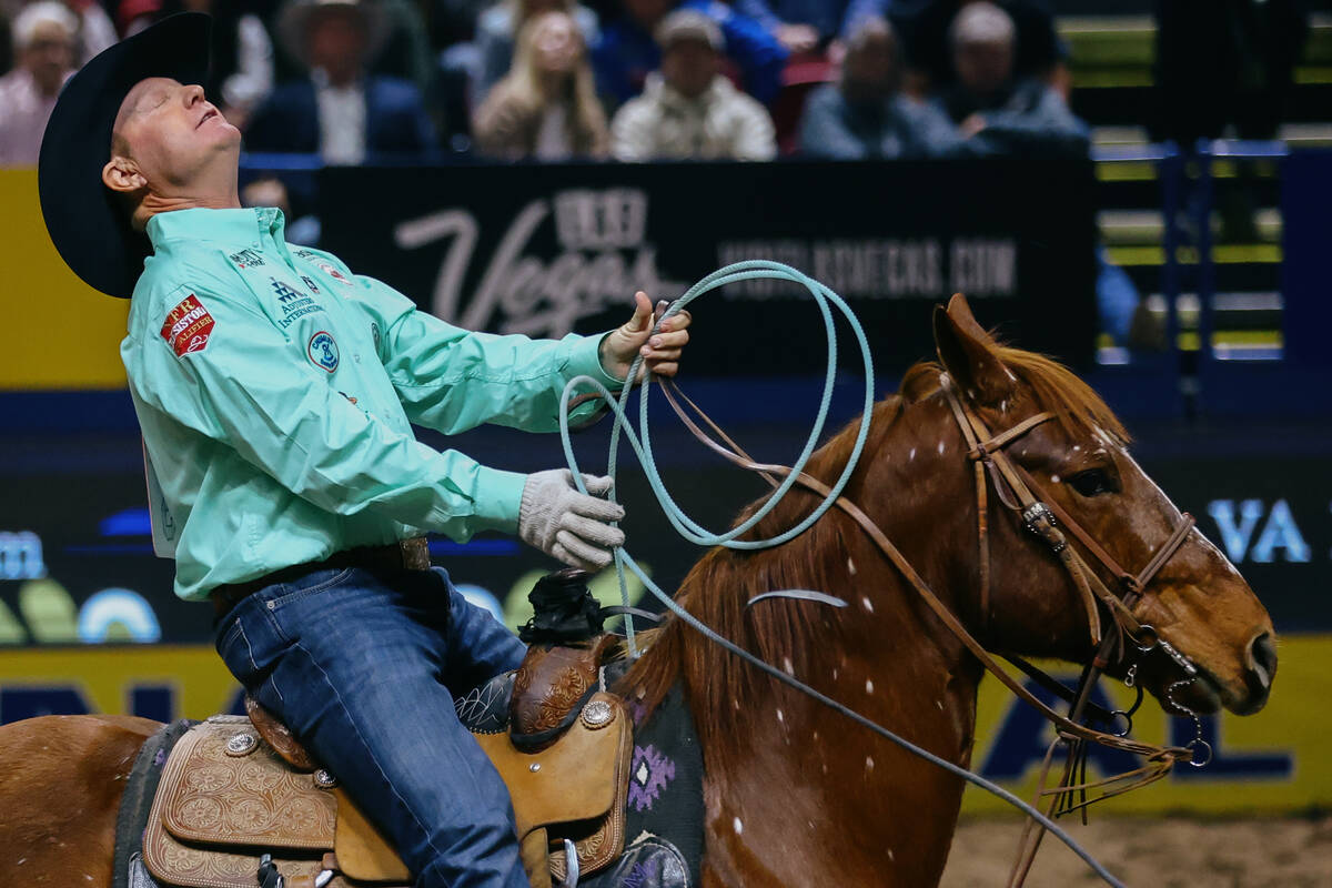 Brady Minor reacts after competing in the team roping event during the seventh go-round of the ...