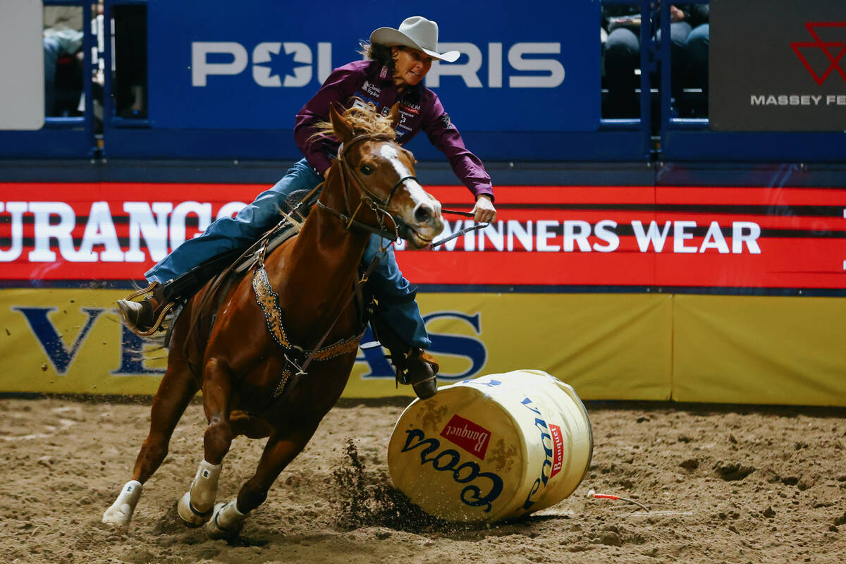 Lisa Lockhart competes in the barrel racing event during the seventh go-round of the National F ...