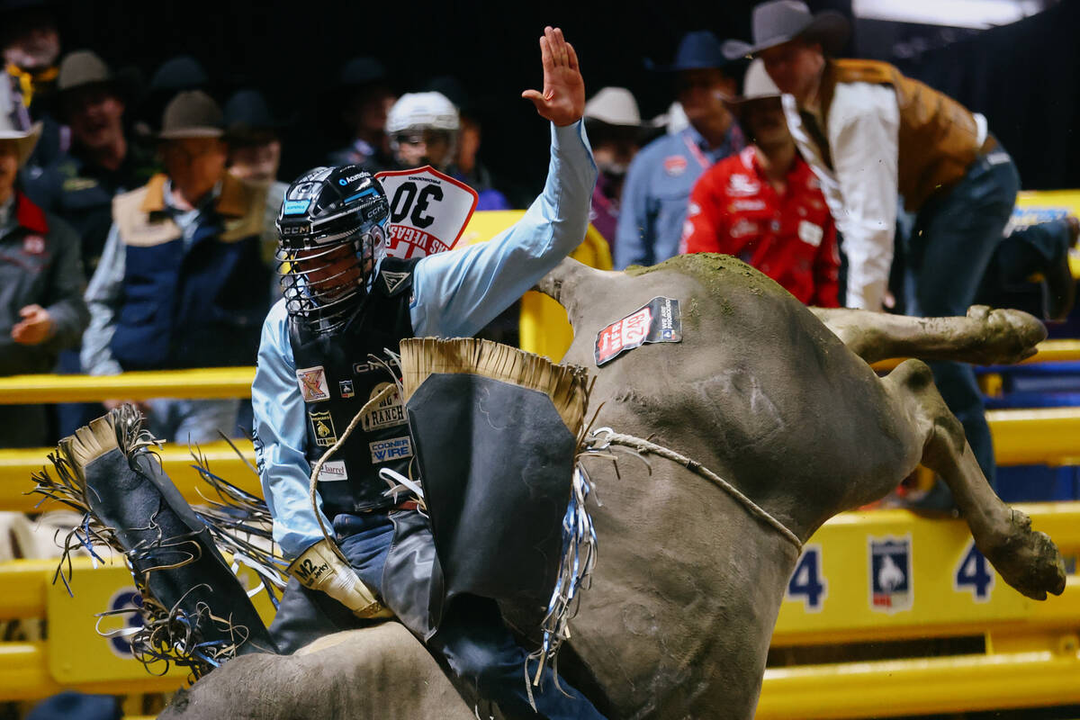 TJ Gray rides Blue Duck in the bull riding event during the seventh go-round of the National Fi ...
