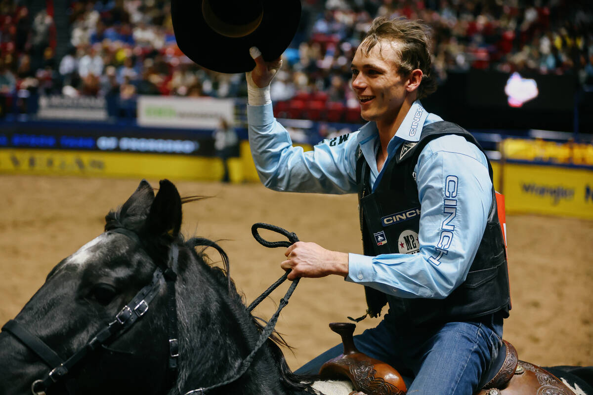 TJ Gray celebrates his win in the bull riding event during the seventh go-round of the National ...
