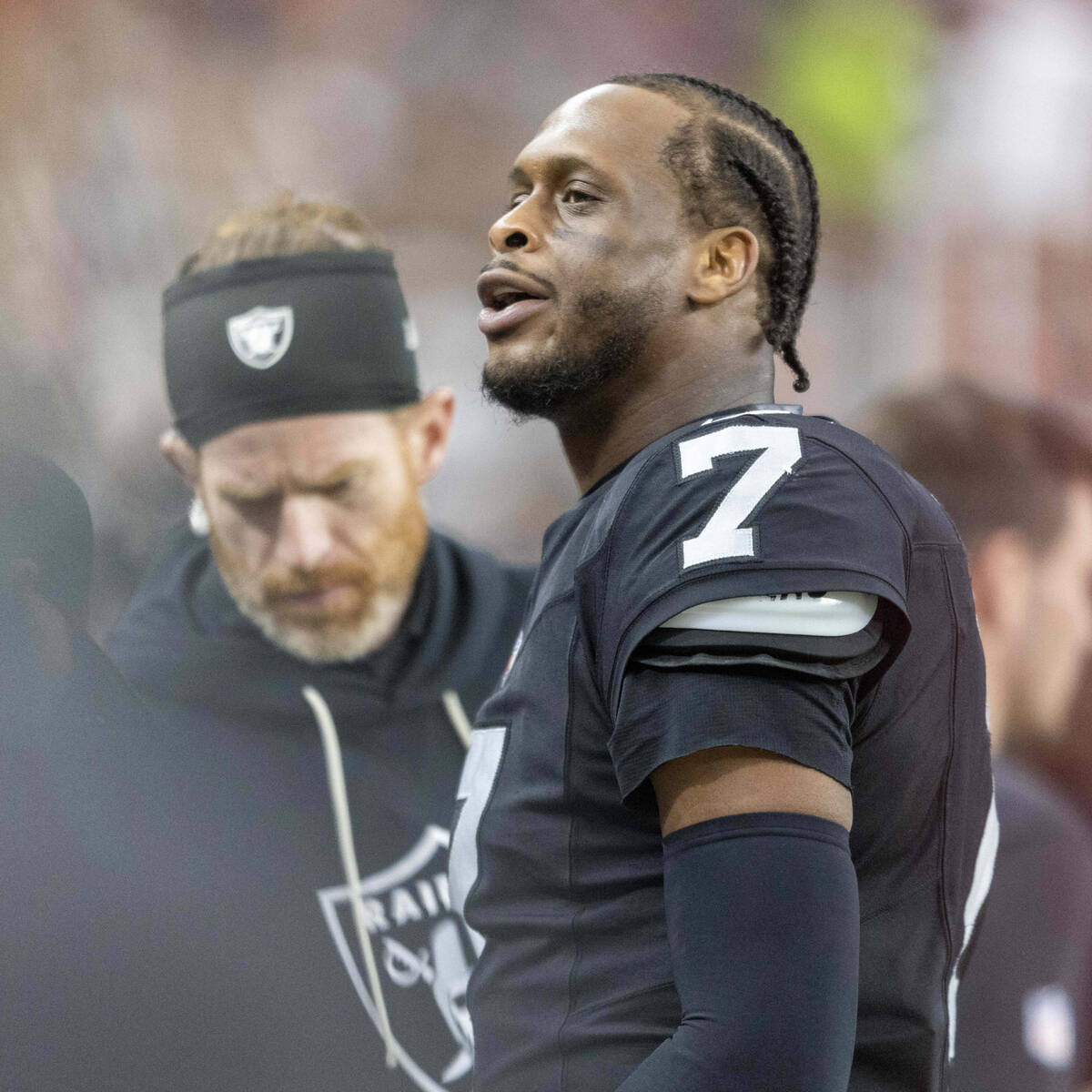 Raiders quarterback Geno Smith (7) responds to a fan from the bench during the second half of a ...