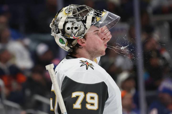 Vegas Golden Knights goaltender Carter Hart spits during the second period of an NHL hockey gam ...