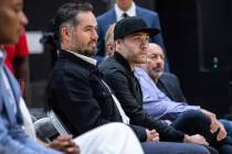 Joey, left, and Jesse Buss, in black hat, during a news conference introducing Darvin Ham as th ...