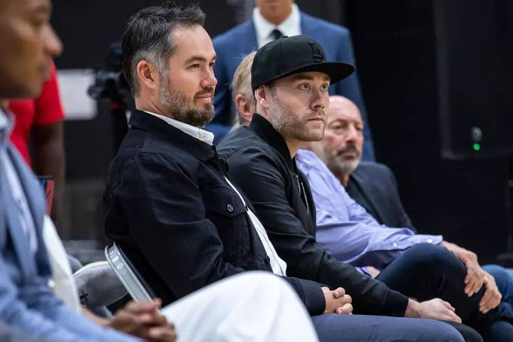 Joey, left, and Jesse Buss, in black hat, during a news conference introducing Darvin Ham as th ...