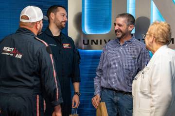 Carmen Losito chats with members of his care team at UMC Trauma Center in Las Vegas on Dec. 10, ...