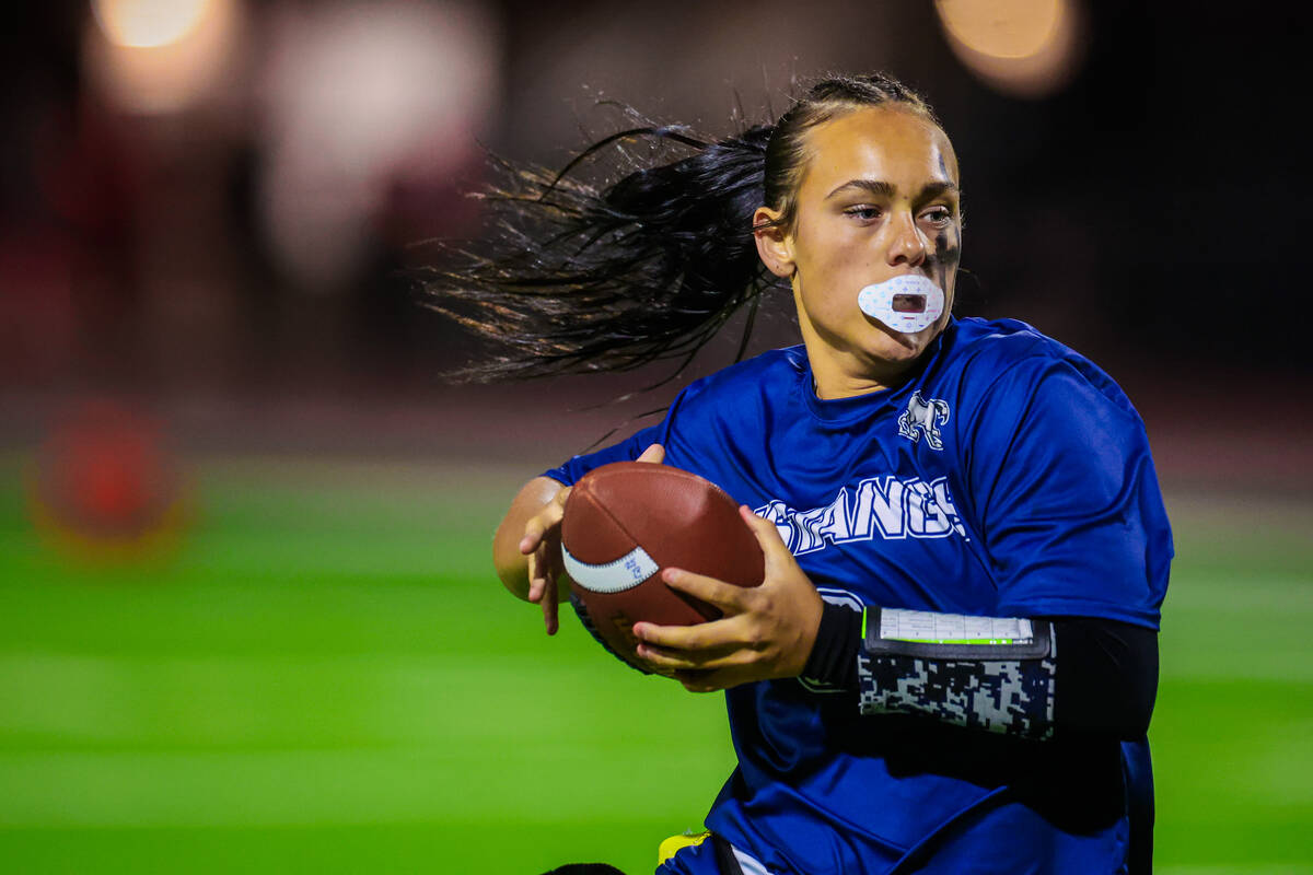 Shadow Ridge’s Chloe Covington runs the ball during a flag football game between Sierra ...