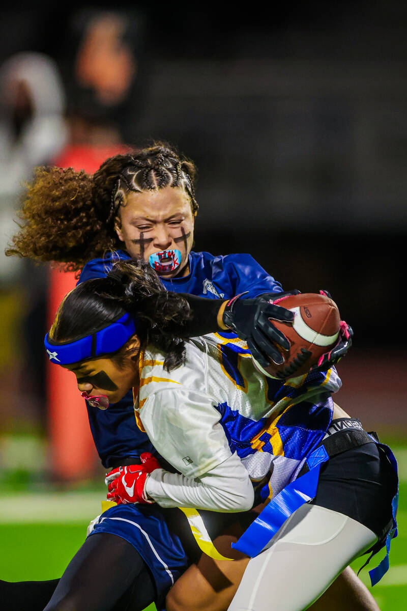 Shadow Ridge’s Mariah Stevens-Walden powers past a defender during a flag football game ...