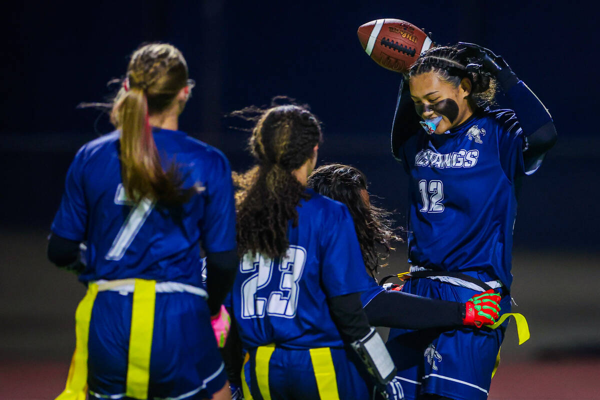 Shadow Ridge’s Jaylani Palmer (12) celebrates a touchdown during a flag football game be ...