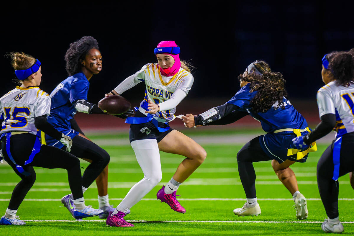 Sierra Vista quarterback Amaya Wusstig (11) gets her flags pulled during a scramble in a flag f ...