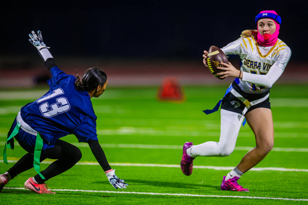 Sierra Vista quarterback Amaya Wusstig (11) scrambles during a flag football game between Sierr ...