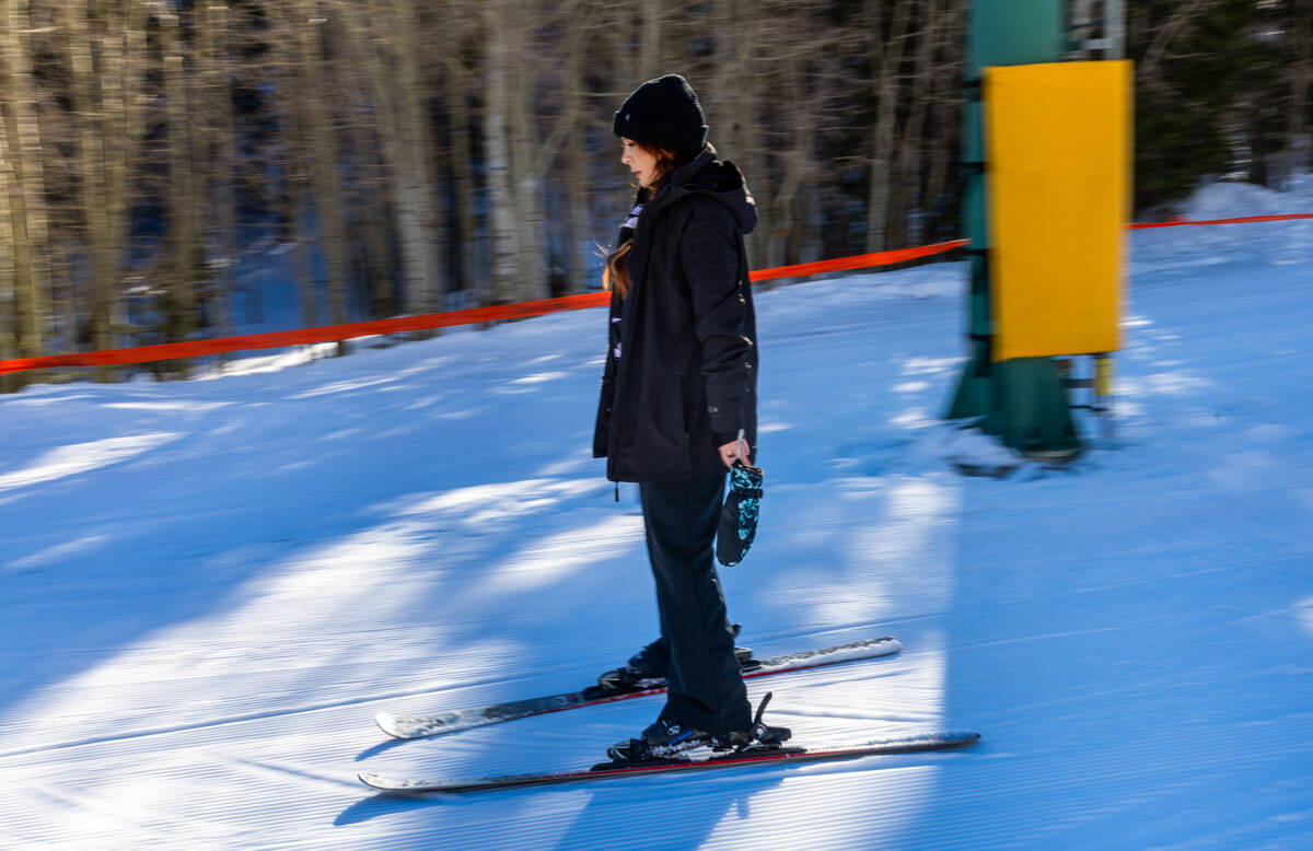 Heather Collins slowly glides down a small slope as she practices balance and stopping on her s ...