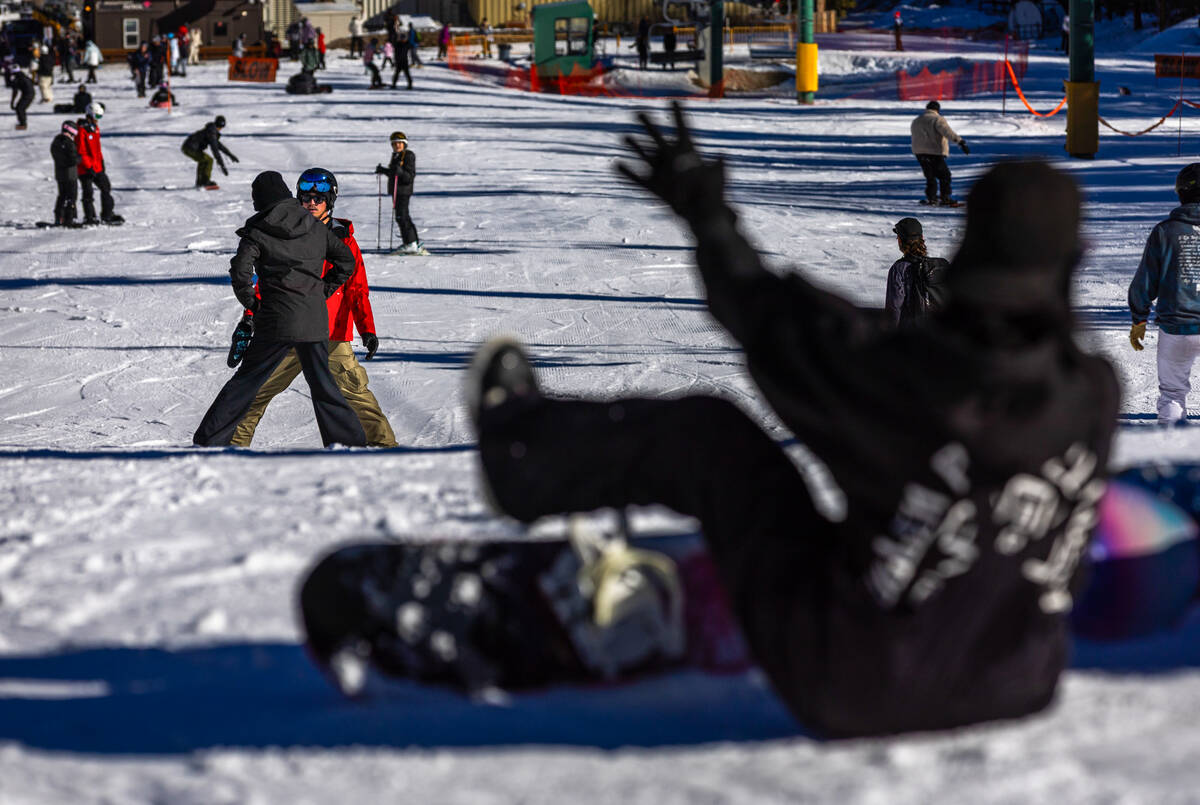 Ski instructor Cole O'Connell, left, works with Heather Collins as she learns to ski at Lee Can ...