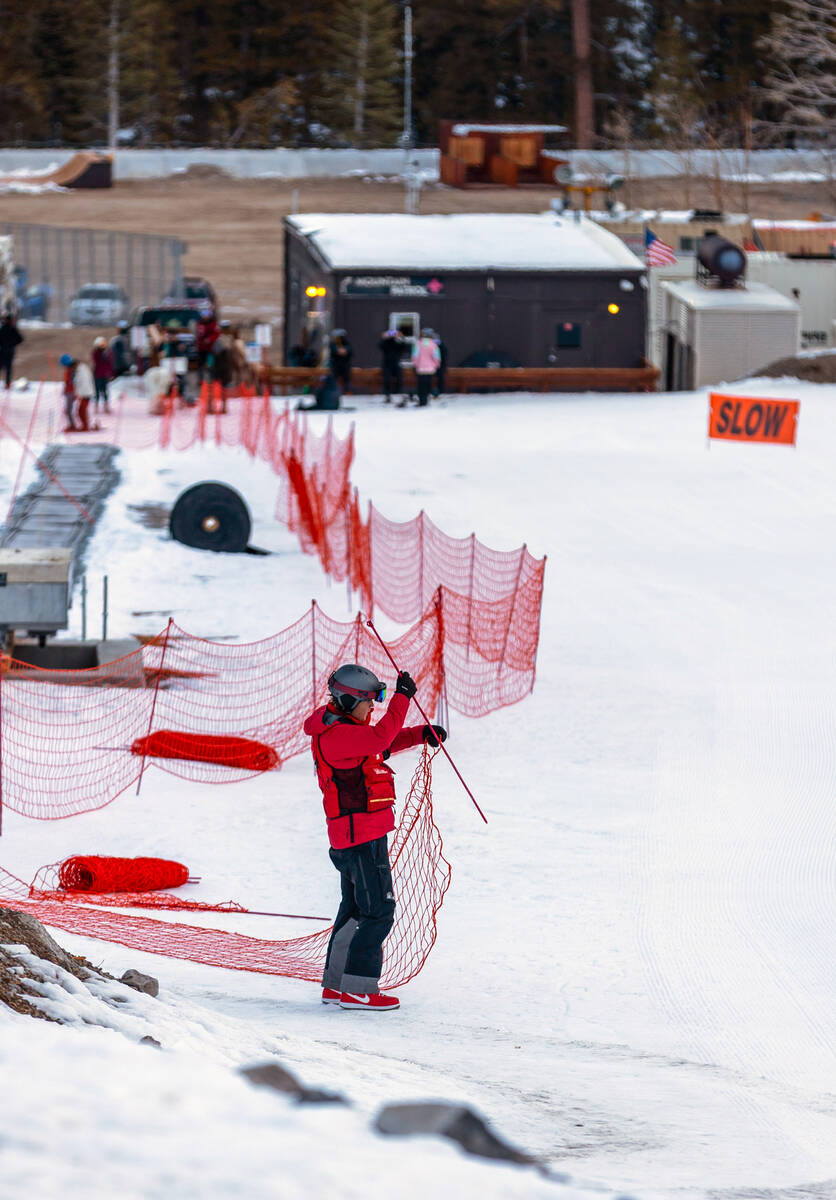 A run worker readies the area for skiers at Lee Canyon on Wednesday, Dec. 10, 2025, outside of ...