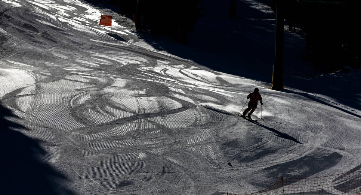 A skier makes one of the first runs of the day at Lee Canyon on Wednesday, Dec. 10, 2025, outsi ...