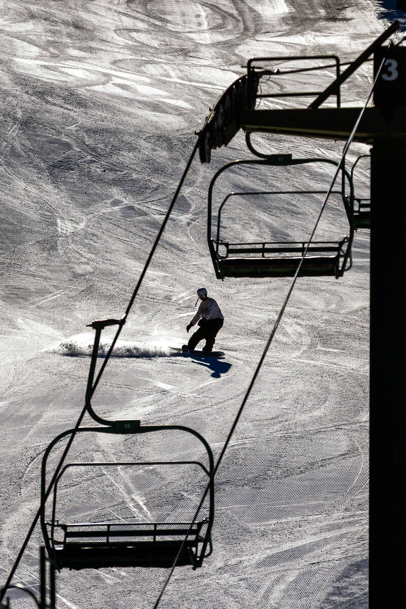 A snowboarder makes one of the first runs of the day at Lee Canyon on Wednesday, Dec. 10, 2025, ...
