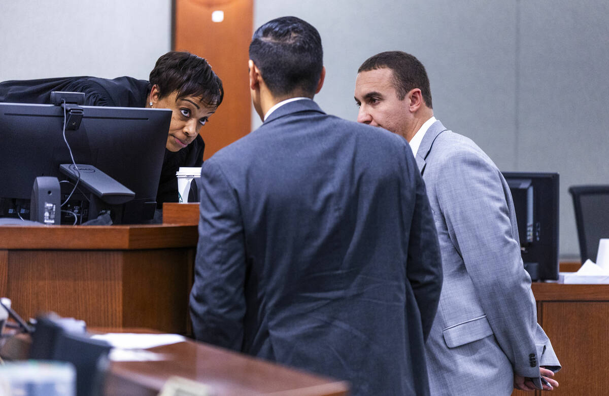 Attorney Ryan Helmick, right, speaks with Judge Tierra Jones joined by the prosecuting attorney ...