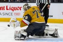 Golden Knights goaltender Carter Hart (79) deflects another Chicago Blackhawks shot during the ...