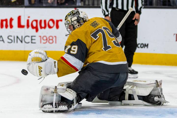 Golden Knights goaltender Carter Hart (79) deflects another Chicago Blackhawks shot during the ...