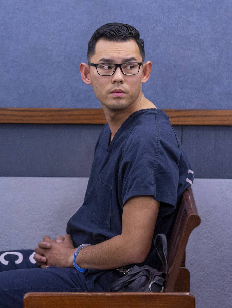 Philippe Dinh, a Las Vegas police officer facing kidnapping and domestic violence charges, awai ...