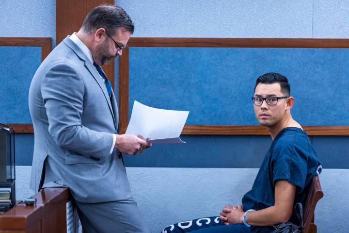 Philippe Dinh, a Las Vegas police officer facing kidnapping and domestic violence charges, sits ...