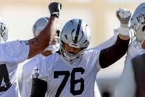 Raiders guard Caleb Rogers (76) reaches into the huddle during the team’s practice at the Int ...