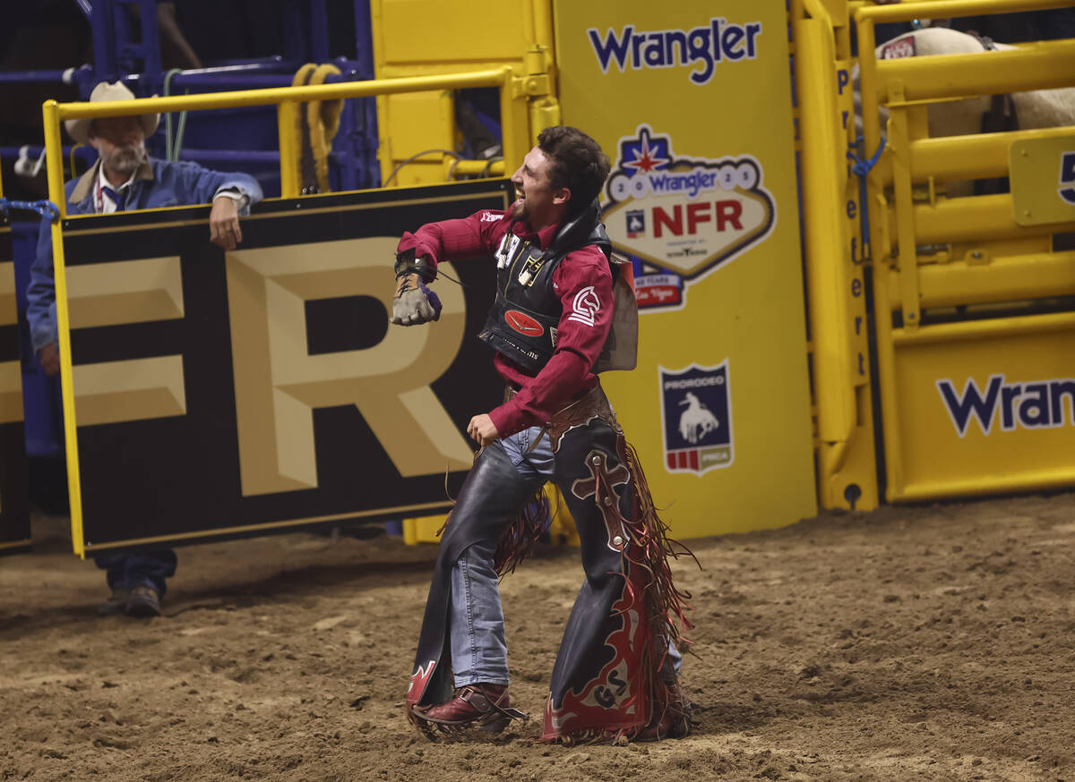 Garrett Shadbolt reacts after competing in bareback riding during the eighth go-round of the Na ...