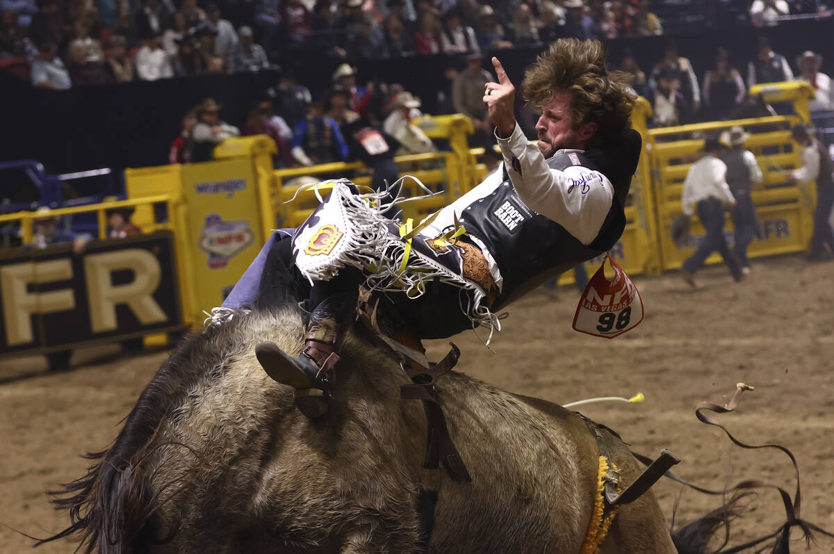 Tilden Hooper rides Straight Ringer while competing in bareback riding during the eighth go-rou ...