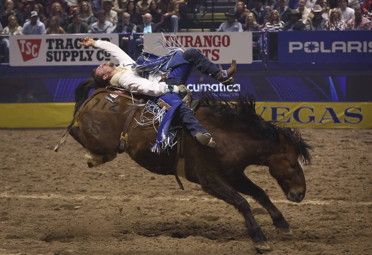 Dean Thompson rides Winning Rose while competing in bareback riding during the eighth go-round ...