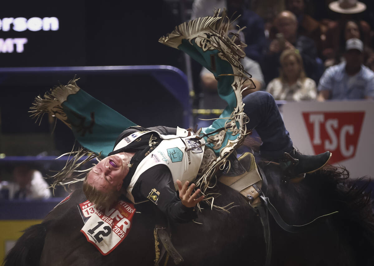 Sam Petersen rides Wild N Out while competing in bareback riding during the eighth go-round of ...