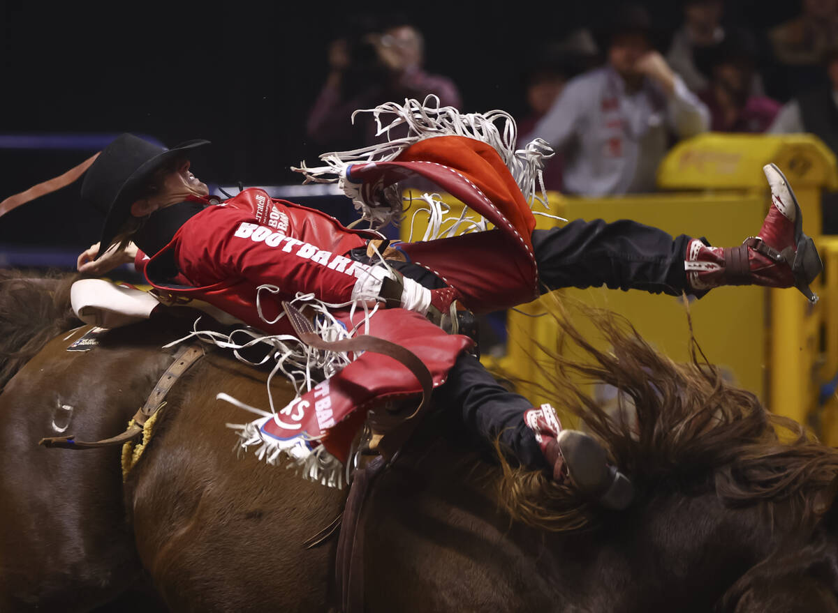 Rocker Steiner rides Queezy Roller while competing in bareback riding during the eighth go-roun ...