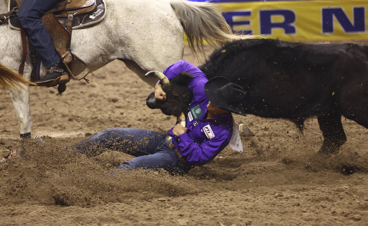 Gavin Soileau competes in steer wrestling during the eighth go-round of the National Finals Rod ...