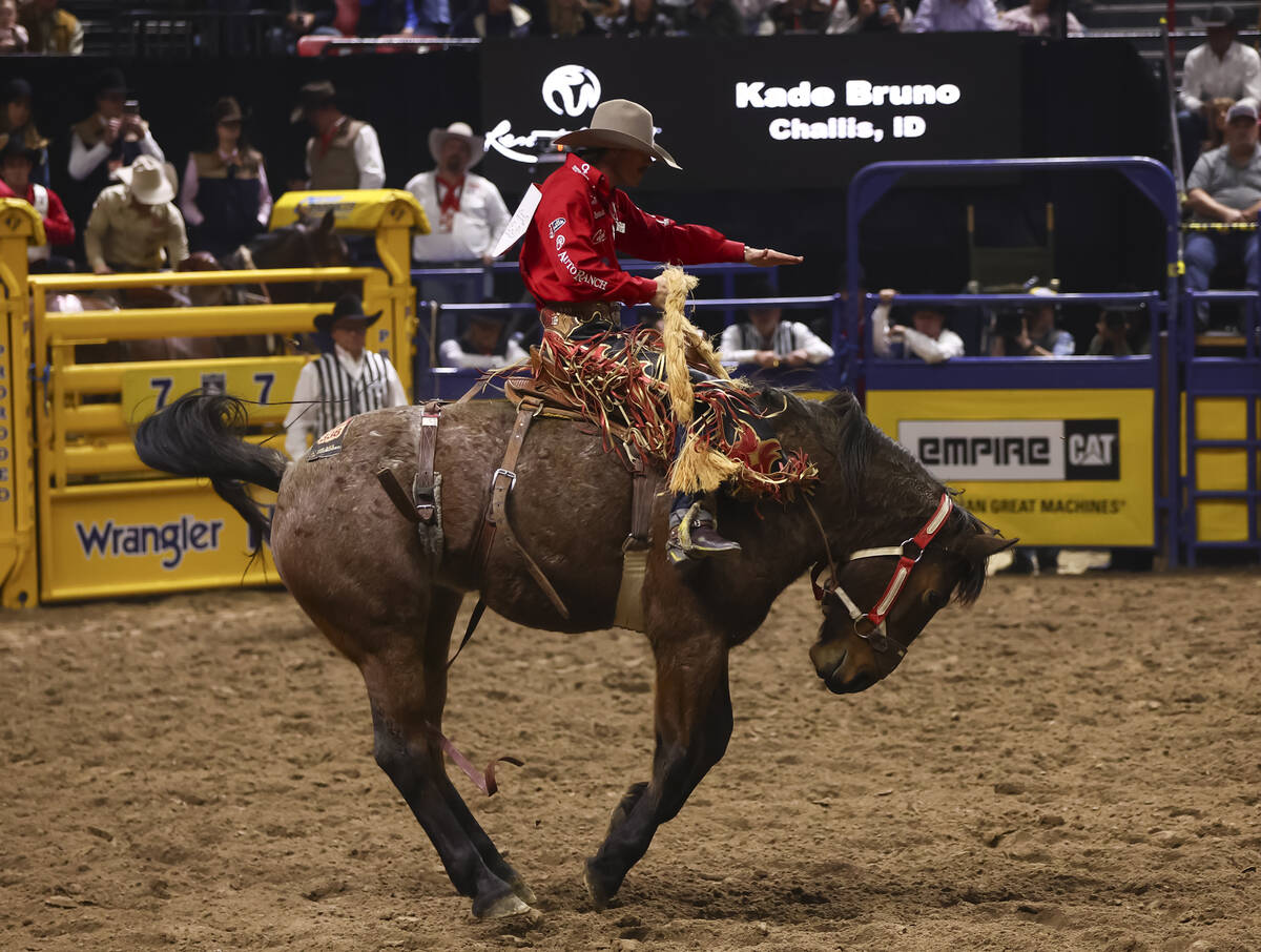 Kade Bruno rides Get Down while competing in saddle bronc riding during the eighth go-round of ...