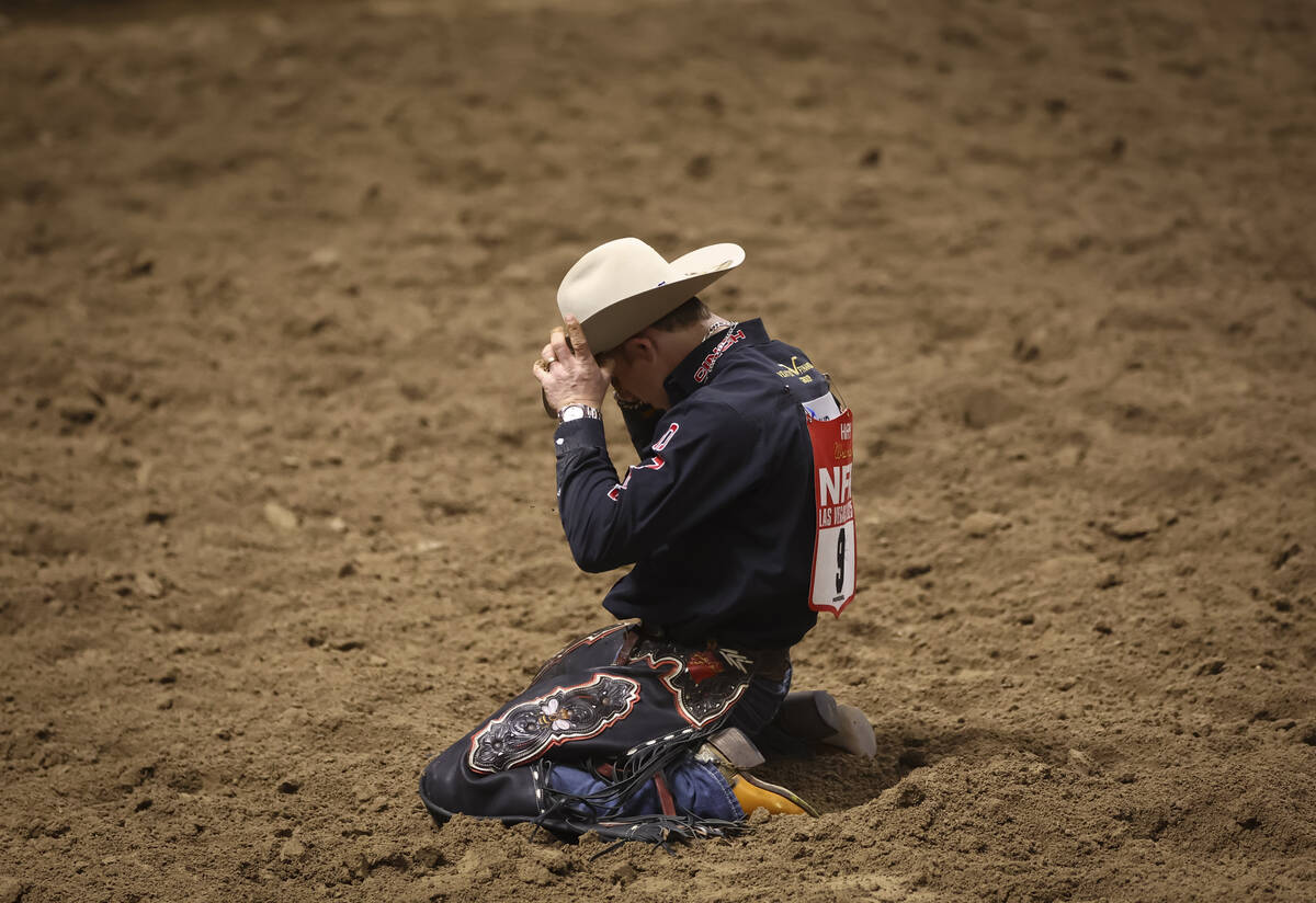 Dawson Hay reacts after getting bucked off by Angel Cat while competing in saddle bronc riding ...