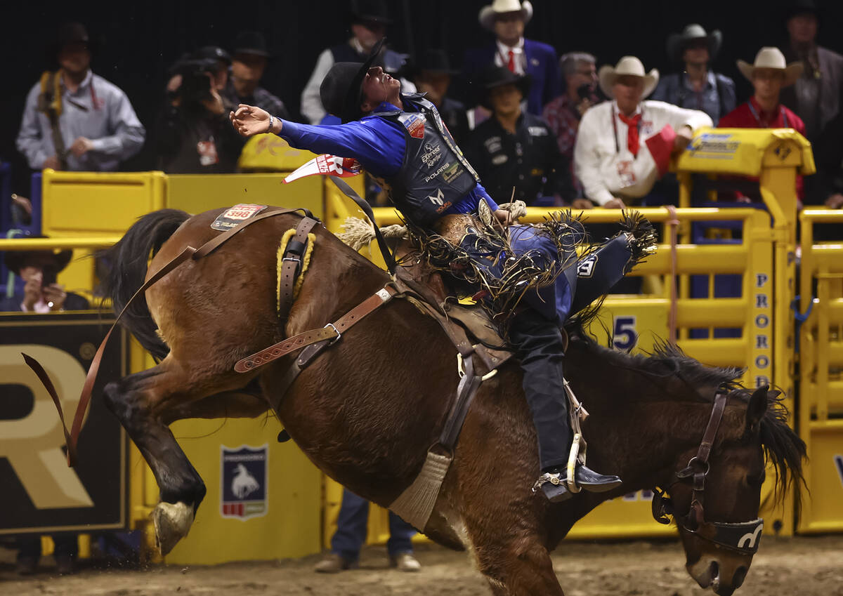 Stetson Wright rides Bobby Shows while competing in saddle bronc riding during the eighth go-ro ...